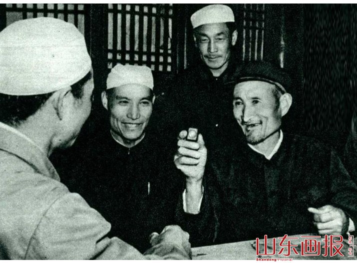 献出微型版本《古兰经》