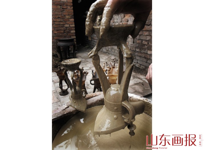 给蜡模裹浆